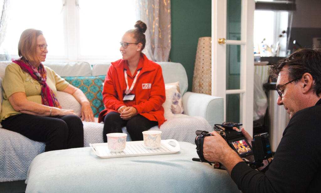 Care worker and client being filmed